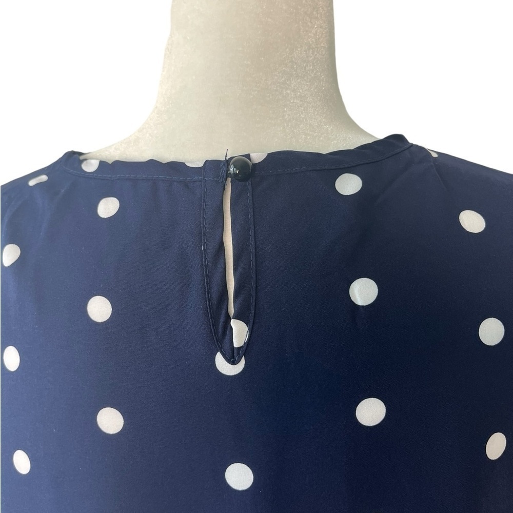 Navy and white sleeveless polkadot dress with ruffle bottom - Picture 6 of 7